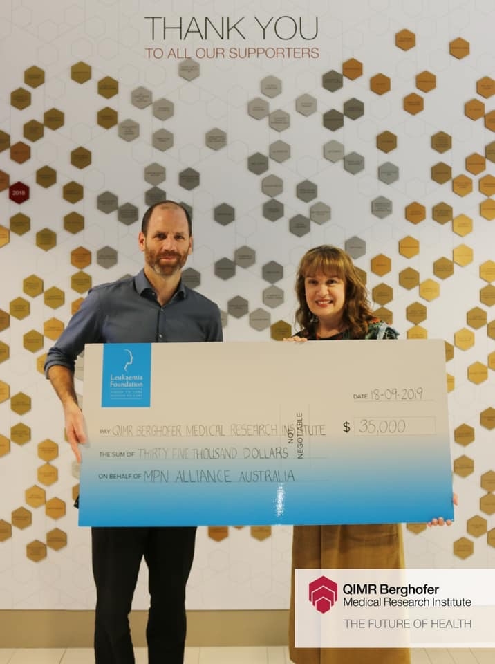 IMG_0469 Photo of Lara Chapman handing over $35 thousand donation to Dr Steven Lane for MPN research